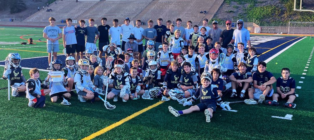 Youth players and LCC players together on the LCC stadium turf